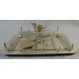 A Silver Asparagus Dish with Butter Boat and Servers,