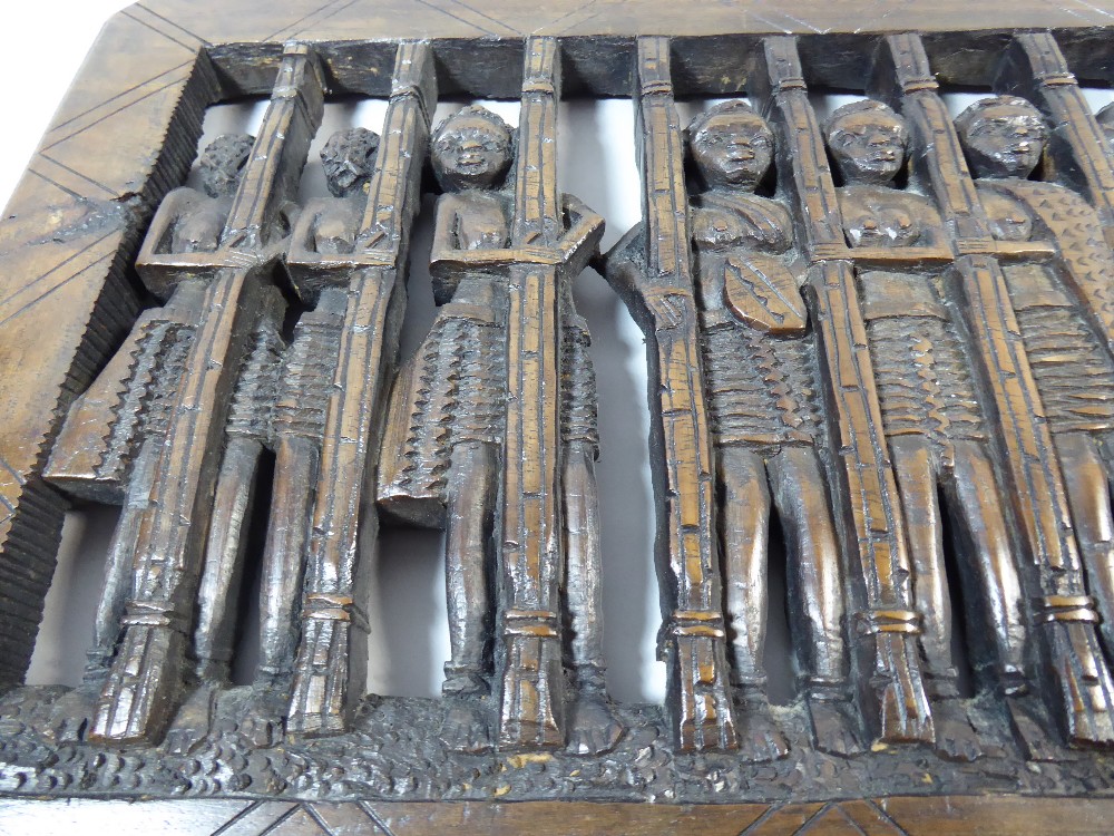 A Carved Wooden African Panel Depicting Twelve Topless Maidens Behind Bars. - Image 4 of 5