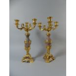 A Pair of French Ormolu and Pink Stone Three Branch Candelabra.