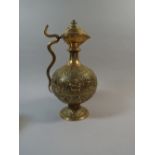 A Heavy Brass Islamic Ewer, Embossed Cartouches Depicting Various Deities.