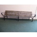 A Late 20th Century Wrought Iron and Wooden Slat Garden Seat.