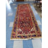 A Persian Heriz Runner 330x105cm