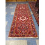 A Persian Heriz Runner 325x110cm