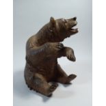 A 19th Century Black Forest Linden Wood Bear Sat on His Haunches.