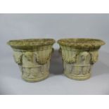 A Pair of Reconstituted Stone Garden Urns with Moulded Swag, Mask and Acanthus Leaf Decoration.