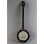 An Unbranded Modified Early 20th Century Five String Banjo. Spruce Back, Mahogany Neck.