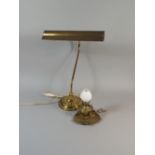 A Brass Desk Lamp and a Gimballed Brass Bed Chamber Oil Lamp