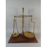 A Large Set of Brass Pan Scales on Wooden Plinth,