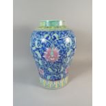 A Chinese Vase Decorated with Foliage and Pink Flowers on Blue Ground, Has Been Glued,
