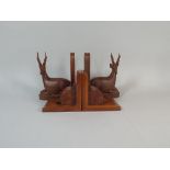 Two Pairs of Cared Wooden Book Ends One in the Form of Stags