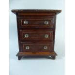 A 19th Century Miniature Apprentice Piece Three Drawer Chest with Turned Glass Handles 26cm Wide