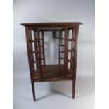 An Edwardian Square Topped Occasional Table with Turned Spindle Decoration to all Sides,