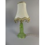 An Edwardian Moulded Green Glass Table Lamp the Support in the Form of Three Maidens,