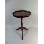 A Modern Tripod Galleried Wine Table with Tooled Leather Top