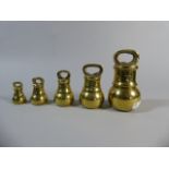 A Set of Five Graduated Brass Bell Weights From 4oz to 4lb