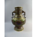 An Enamelled Bronze Two Handled Oriental Vase with Coloured Decoration and Elephant Handles,