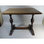 An Edwardian Oak Rectangular Topped Occasional Table with Turned Supports,