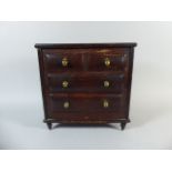 A Miniature Stained Pined Chest of Two Short and Two Long Drawers with Brass Handles,