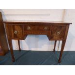 A Good Quality Crossbanded Walnut Ladies Writing Desk with Centre Long Drawer Flanked by Two Deeper