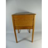 An Oak Lift Top Sewing Cabinet with Base Drawer Containing Cottons and Sewing Accessories,