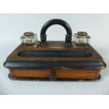 A Walnut and Ebonised Desktop Ink Stand with Two Glass Bottles and Base Drawer,