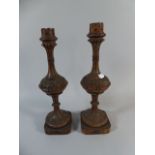 A Pair of Gothic Revival Carved Wooden Candle Sticks,