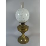 A Brass Oil Lamp with Etched Opaque Globe and Duplex Controls,