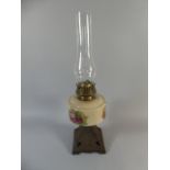 A Late Victorian Cast Iron Based Oil Lamp with Squirrel Decoration Having Ceramic Reservoir,