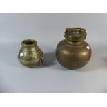 A Brass Globular Water Carrier and an African Glass Pot