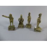 Four Brass Figural Studies of Dickens Characters Standing on Books,