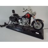 A Novelty Telephone in the Form of a Harley Davidson Motorcycle,one handle bar missing,
