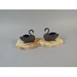 A Pair of Onyx Based Former Book Ends with Metal Swan Mounts