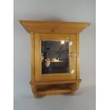 A Pine Wall Hanging Cabinet with Mirrored Door,