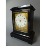 A French Ebonised Cased Clock with Etched Gilt and White Enamel Dial. Missing Pendulum and Fingers.