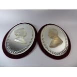 A Pair of Victorian Oval Velvet Framed Mirrors with Opaque Glass Mounts of Victoria and Albert