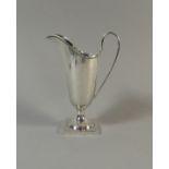 A Sterling Silver Jug on Square Plinth Base, 13cm High. Sheffield 1950. 87.6gms.