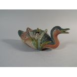 An Oriental Stoneware Box Modelled as a Seated Duck Sat amongst Irises.