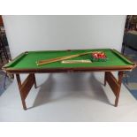 A Quarter Size Snooker Table By Meirlodge Having Folding Supports and Complete with Cues,