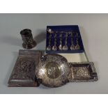 A Collection of Dutch Silver Plate to Include Spill Vase, Note Pad Holder, Spoons and Two Ashtrays.