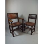 A Set of Six Oak Framed Leather Upholstered Dining Chairs with Brass Studding.