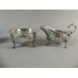 A Matching Irish Silver Cream Jug and Sugar Bowl with Embossed Decoration Depicting Fox and Swan in