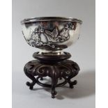 A Small Chinese Silver Bowl Decorated in Relief with Birds on Branches.
