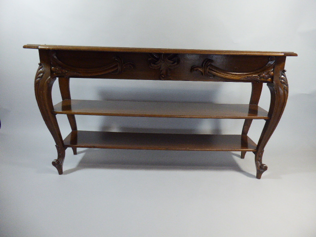 An Edwardian Mahogany Two Shelf Open Bookcase with Carved Cabriole Supports and Scrolled Feet.