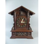 A Large Black Forest Carved Oak Mantle Cuckoo Clock with Eight Day Movement Striking on a Gong by