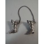 A Pair of Continental Silver Novelty Miniature Cavalry Boots with Spurs. Stamped 900. Each 4cm Tall.