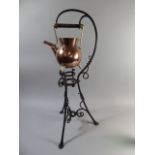 A Christopher Dresser Copper and Brass Spirit Kettle on Wrought Iron Floor Stand.