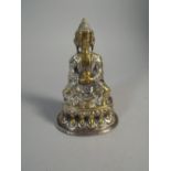 A 19th Century Silvered Brass Model of a Seated Buddha on Stylised Lotus Leaf Base.