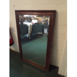 An Oak Framed Rectangular Mirror with Moulded Decoration.