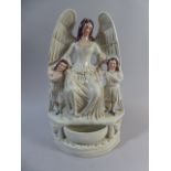 A 19th Century Staffordshire Holy Water Stoup in the form of Angel with Two Girls Either Side.
