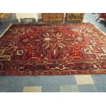 An Antique Persian Heriz Carpet.